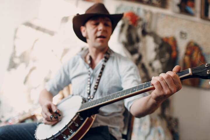 Musician playing on a banjo